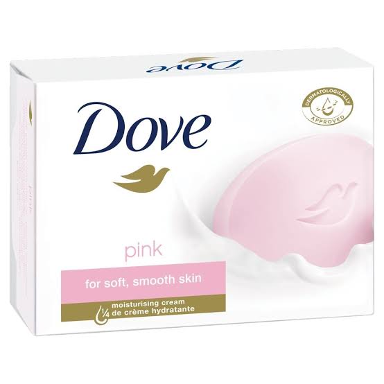 Dove pink moisturising cream soap bar in its white retail box, featuring the navy Dove logo, gold bird emblem, and a pink soap bar graphic on a white background.