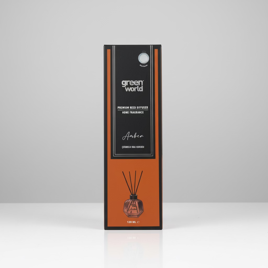 Green World Amber reed diffuser box packaging standing on a wooden table against a stone wall background.