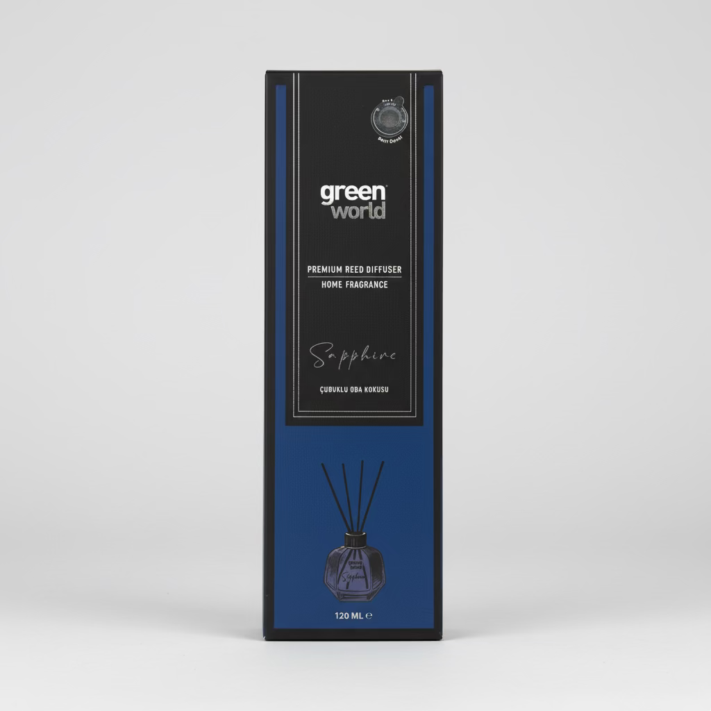 A tall rectangular Green World reed diffuser box in dark gray and blue stands on a wooden surface against a stone wall background. The front label reads 'green world', 'Premium Reed Diffuser Home Fragrance', and 'Sapphire'.