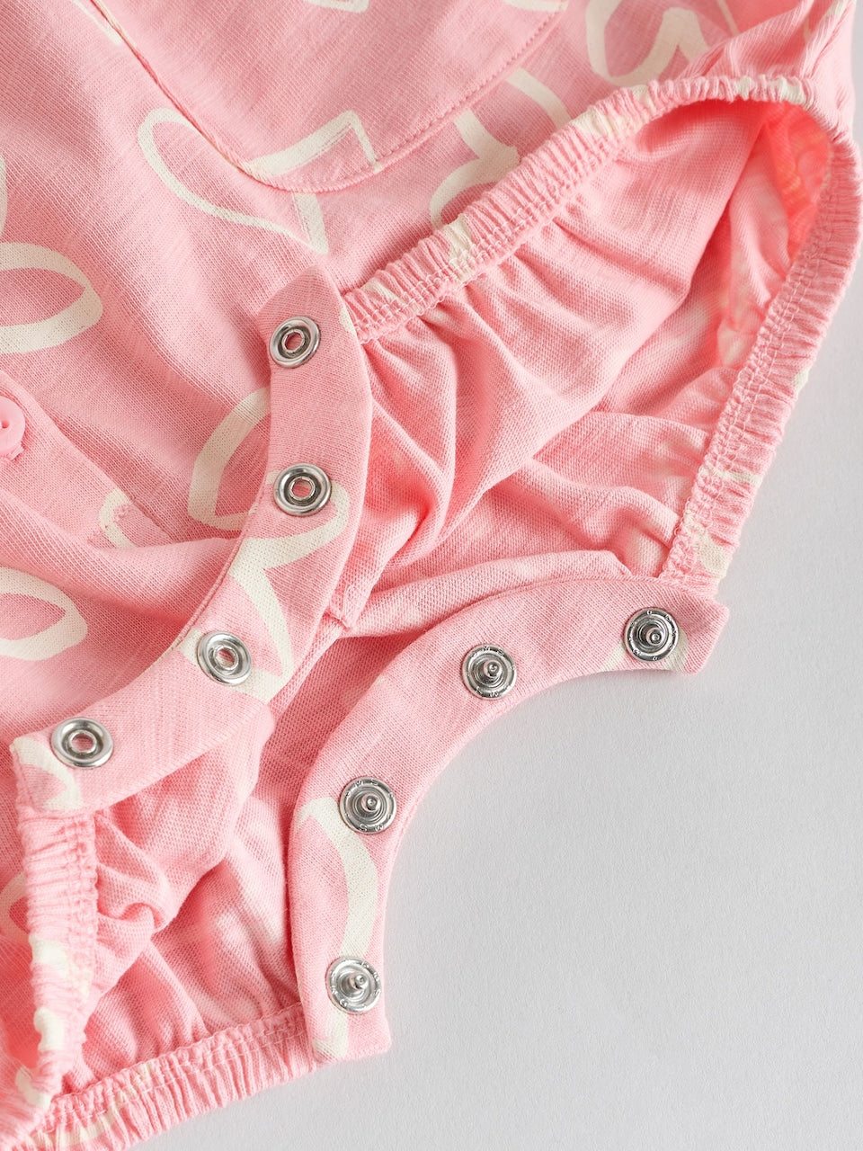 Next Romper/ Bodysuit in Rose , Pitaya and White 6-9 months
