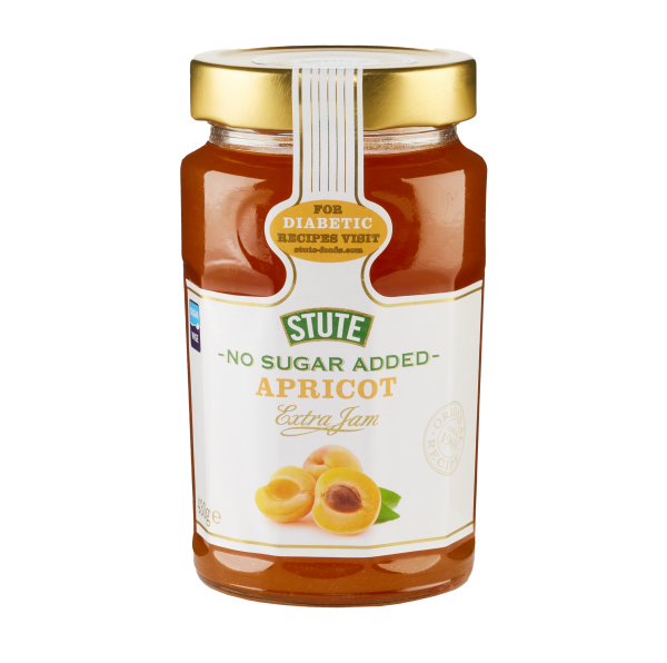 A glass jar of Stute Apricot Extra Jam with a gold lid and white label, featuring apricot illustrations and a diagonal seal for diabetic recipes visit, isolated on a white background.