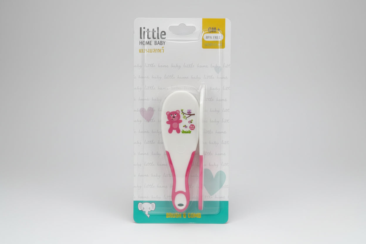 Baby hairbrush in packaging with 'little home baby' branding on a white background