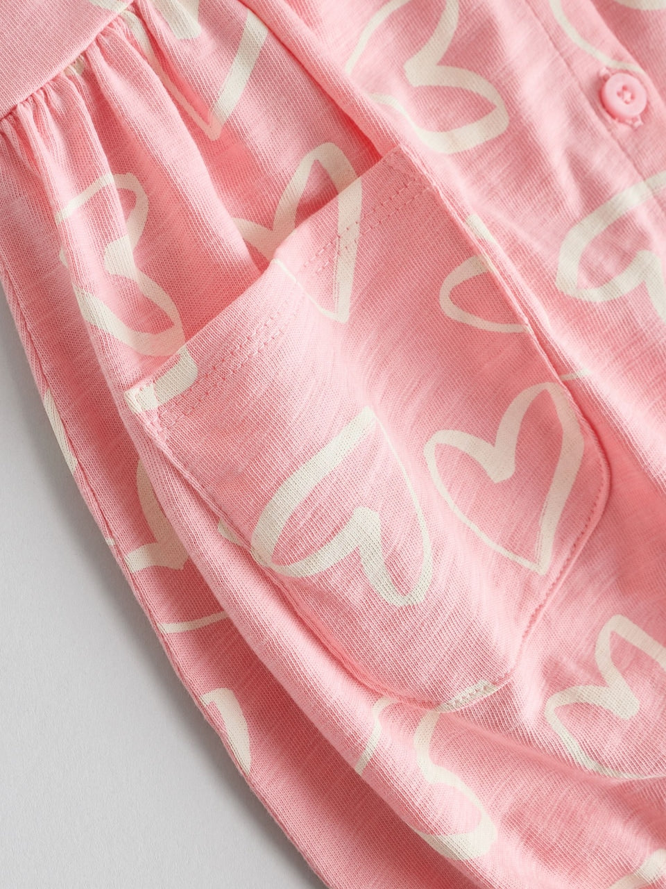 Next Romper/ Bodysuit in Rose , Pitaya and White  6-9 months