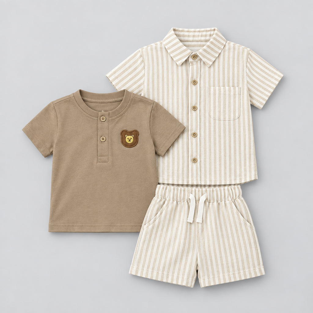 A baby clothing set laid flat on a gray textured background, including a tan short-sleeve henley top with a bear patch, a cream and tan striped short-sleeve button-front shirt, and matching cream and tan striped shorts. White text in the upper left reads 'Z-1155B-1# 6m-24m 10pcs in pack.