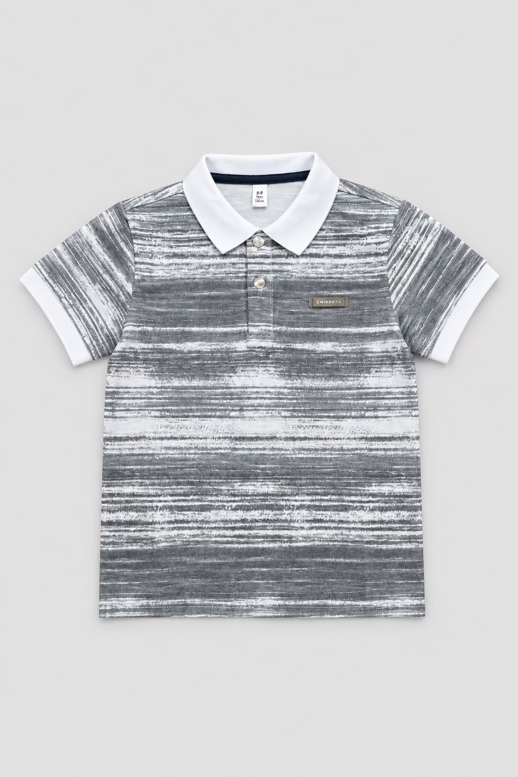 A short-sleeve polo shirt with a gray and white vertical stripe pattern, laid flat on top of a brown cardboard box over a light wood floor.