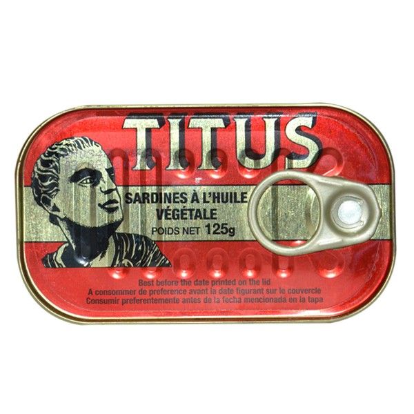 Tin can labeled 'Titus' with a red background and vintage design.